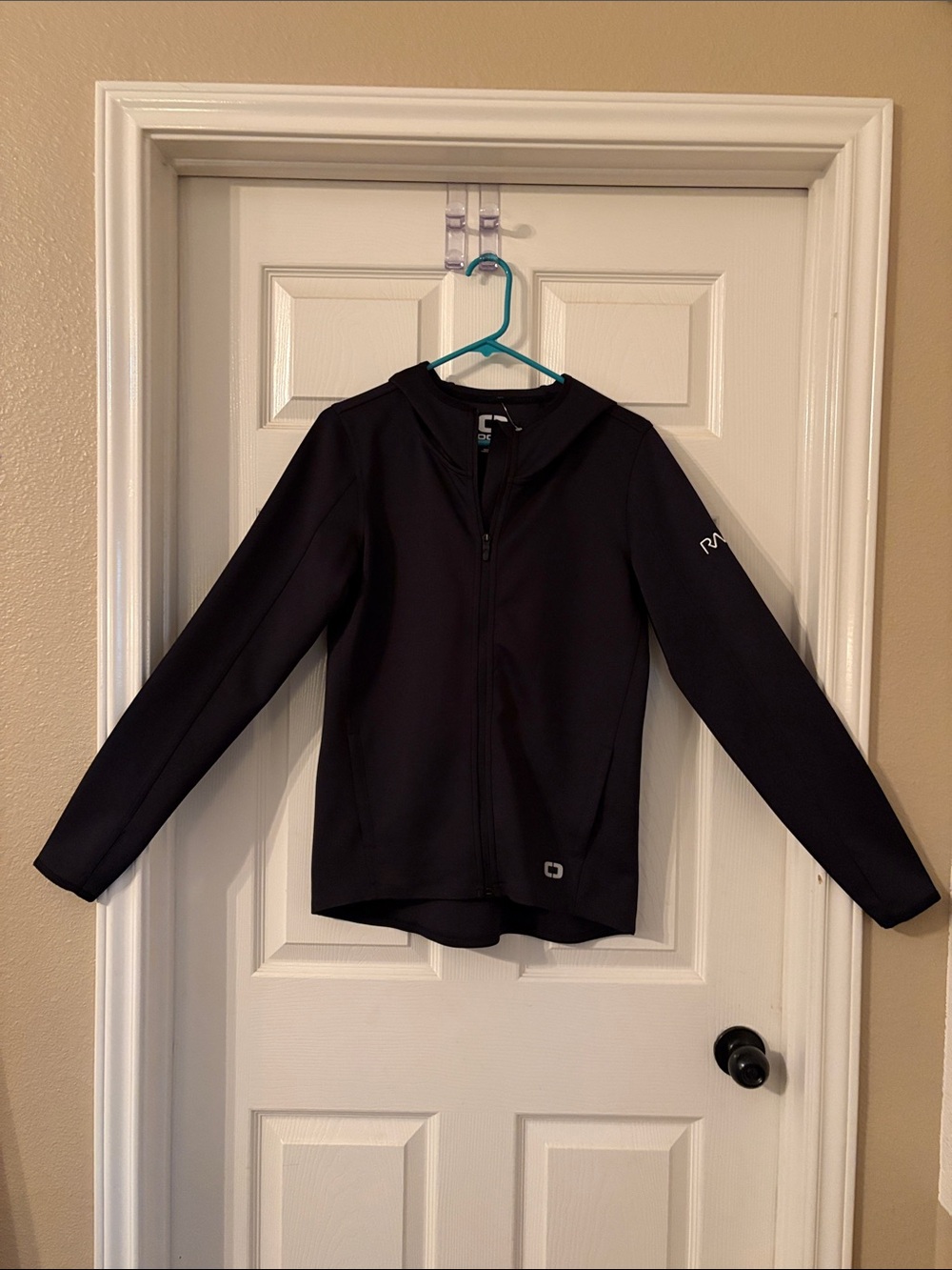 Ogio Black Zip-Up Jacket Size S. Sleeves w/ thumb holes. Vented back. NWT